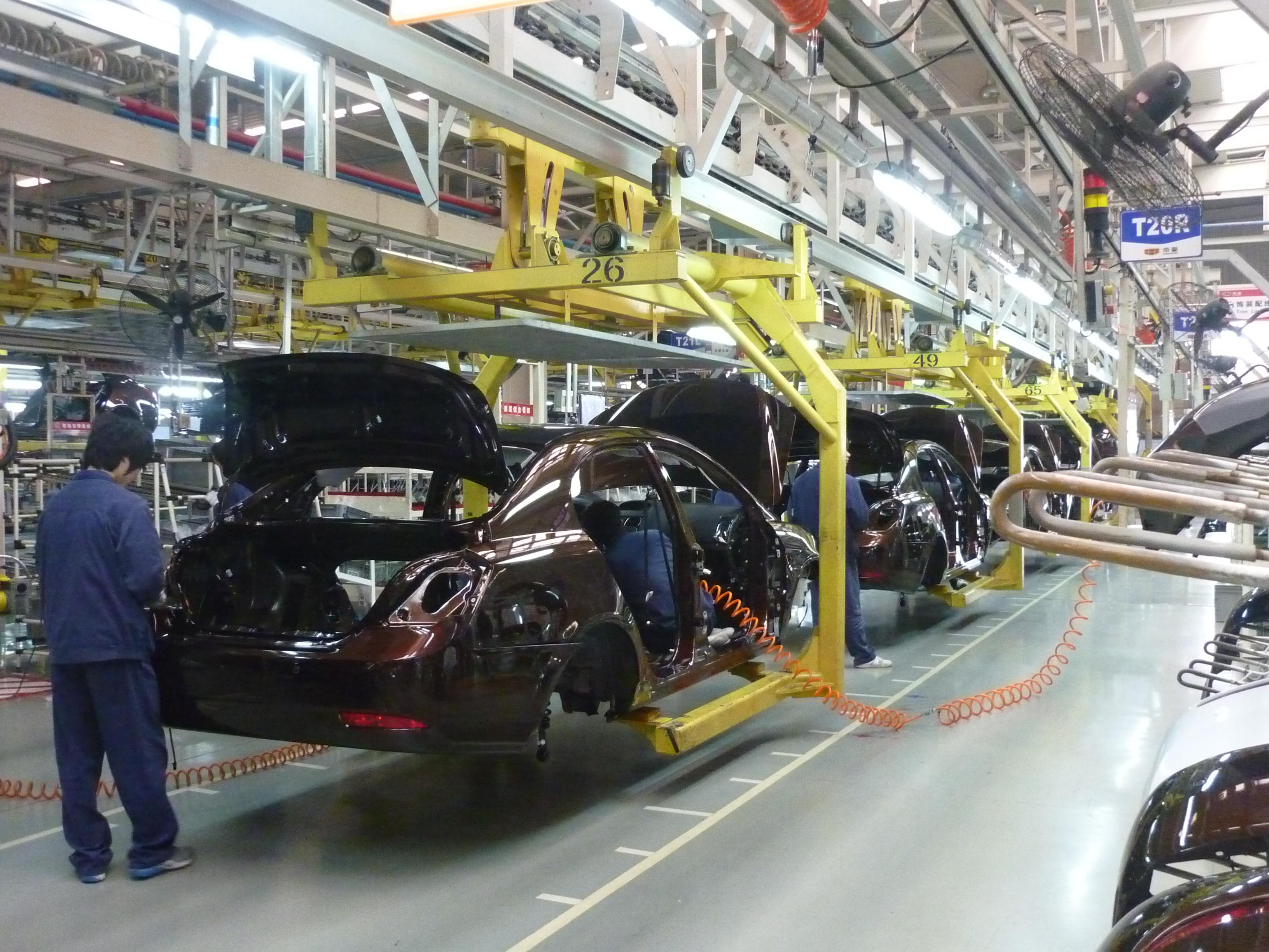 Chinese cars at assembling stages on the production line