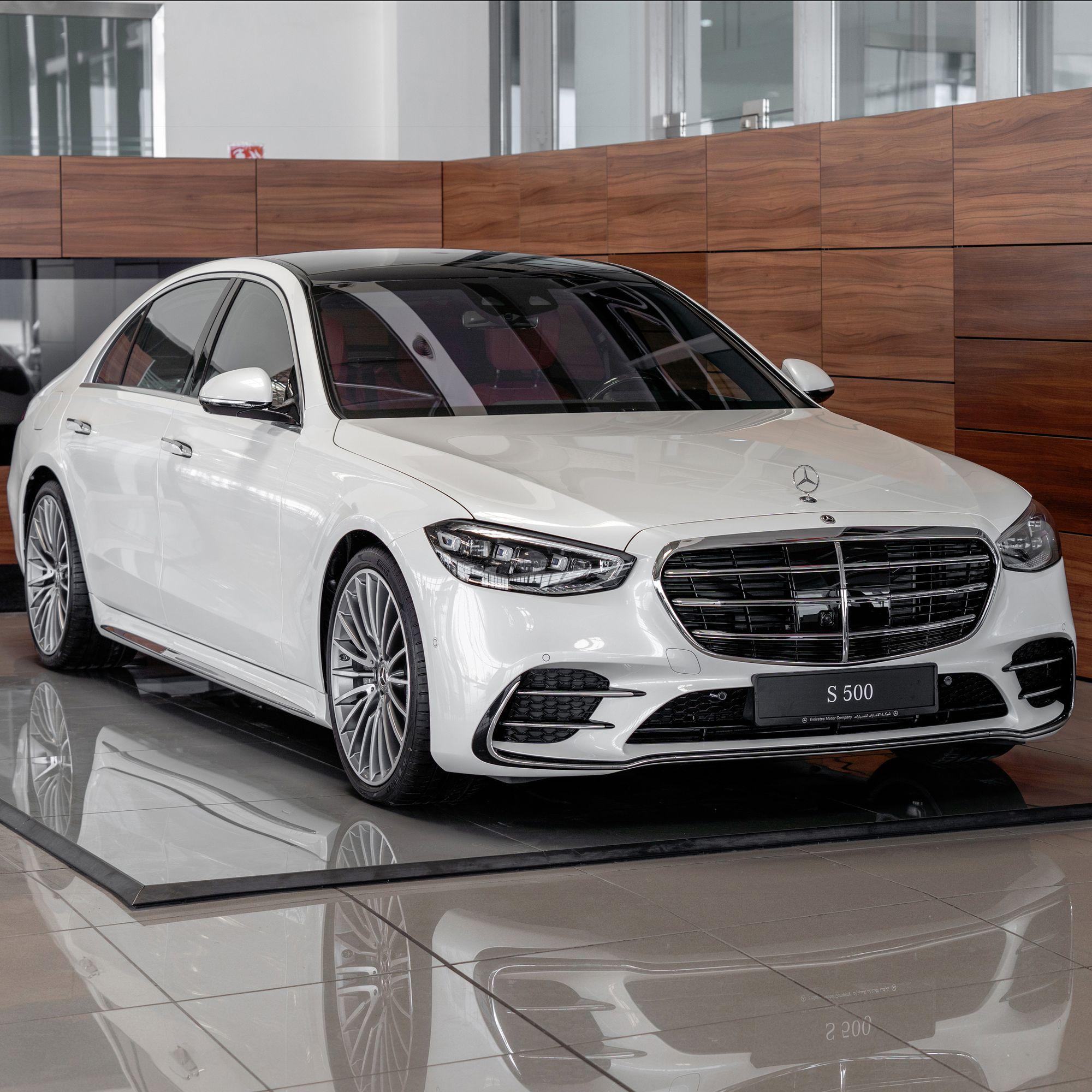 White Mercedes-Benz S 500 in a showroom